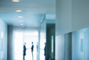 Distant view of greeting in modern office